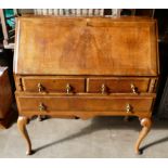 Queen Anne style bureau on cabriole supports, walnut veneer crossbanded,