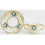 A Minton early 20th century Pâte-sur-Pâte two handled cup & saucer,