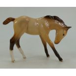 Beswick foal in dun facing down,