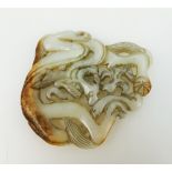 Chinese white and russet jade dragon pendant,