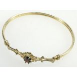 9ct gold bangle set with garnets weight 5.