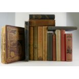 A collection of early hardback books including Pilgrims Progress by John Bunyan,
