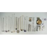 A collection of jewellery including silver rings, silver necklaces, silver pendants,