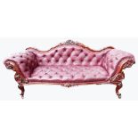 Victorian mahogany chaise longue upholstered in buttoned leather and heavily carved on cabriole