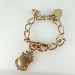 9ct gold bracelet with gold attachments. 40.5 grams.