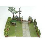 A large collection of Britains lead garden related pieces to include paving, walling,