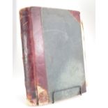 Leather bound book containing various cuttings,