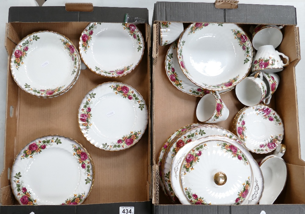 A collection of English Rose Bone China dinner ware to include plates, bowls, saucers,