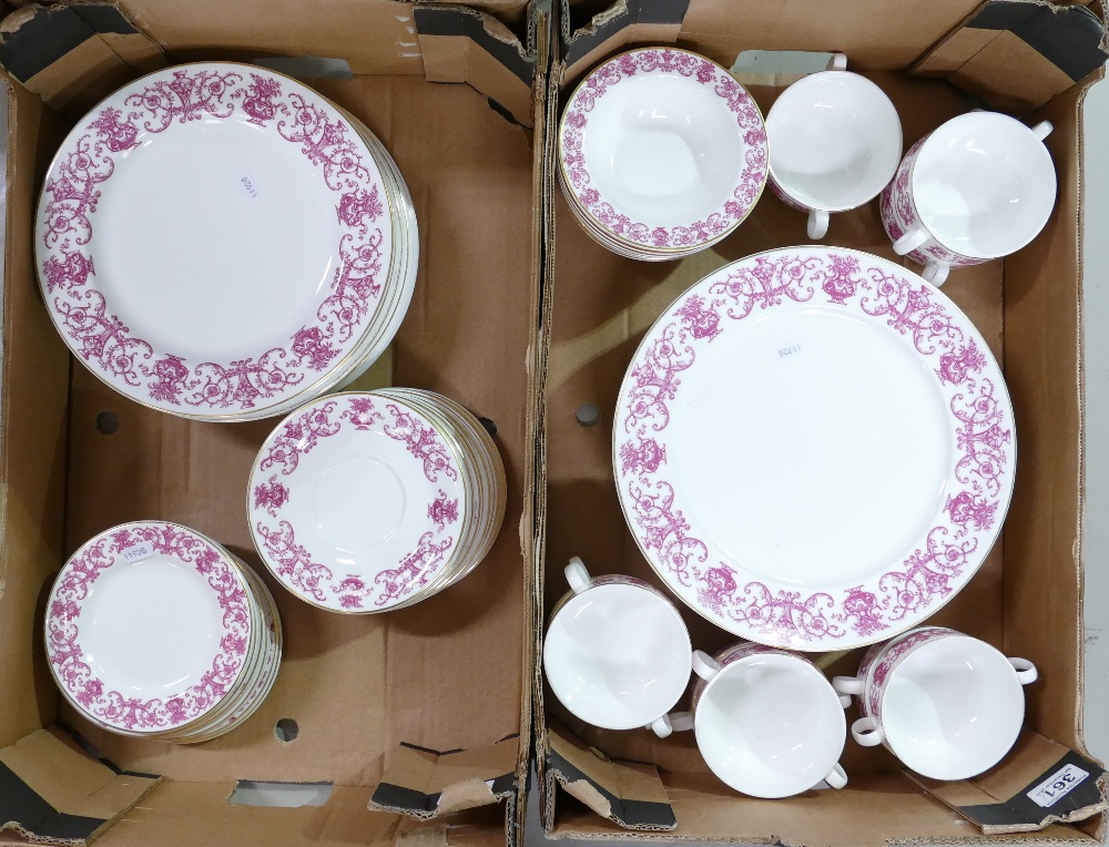 A collection of Royal Doulton hotel ware decorated in puce on white to include dinner plates,