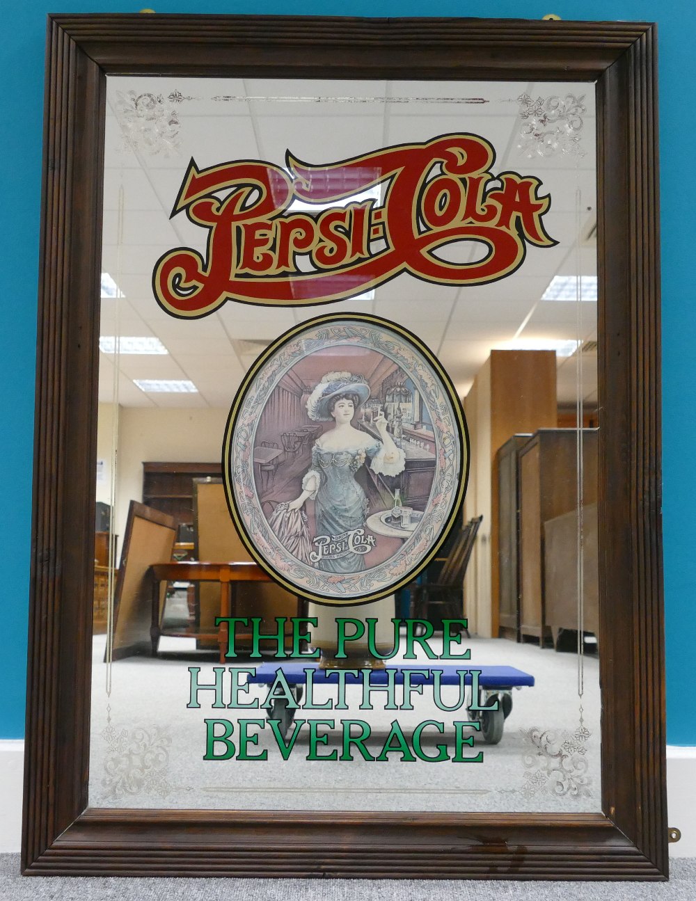 Vintage framed advertising mirror for Pe