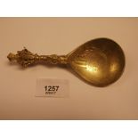 Norwegian apostle style ornamental spoon with figural grip and chased bowl, 5''