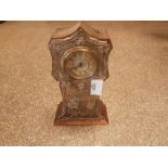 Edwardian mantle clock with embossed silver front depicting a peasant woman and girl Birmingham 1905