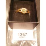 22ct gold ring set with a single green stone