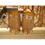 Pair of White metal embossed tankards