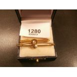 9ct gold bar brooch inset with a diamond and another set with a pearl