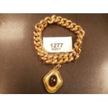 15ct gold curb bracelet with yellow metal mourning pendant 40.3g