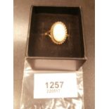 9ct gold dress ring set with a large opal