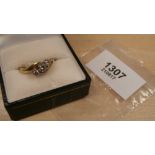 Lady's 3 stone illusion set diamond ring on 18ct yellow gold shank