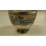 Small Russian white coloured metal bowl with all round niello decoration of buildings signed r.b.