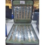 Cased set of 12 Edwardian silver dessert knives and forks, ornate embossed handles, Sheffield 1900