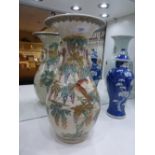 A Japanese Satsuma porcelain vase with all over flower, bird and leaf design fitted double ring