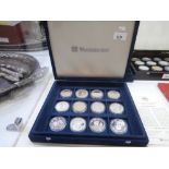 Collection of silver commemorative coins, cased