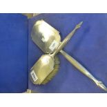 Art deco silver backed hand mirror and matching hair brush with engine turned decoration