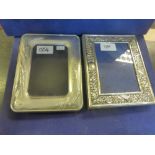 Embossed silver photograph frame, 14cm x 18cm and one other silver fronted photograph frame embossed