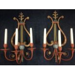 A pair of decorative regency style wall sconces