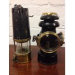 A Richard Johnson Clapham & Morris miners lamp with tapering numbered chimney above a rippled