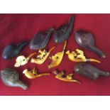 A collection of six cased carved meersham pipes