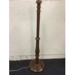 A Victorian mahogany standard lamp, with heavy bulbous turned column raised on circular moulded