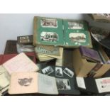 A quantity of albums - stamp with many loose stamps, photograph, cigarette - both empty & full,