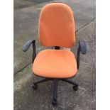 A modern office chair with hooped padded back and rounded seat, supported on an adjustable column