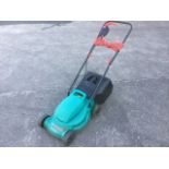 A Bosch 320 electric garden lawnmower with grass box.