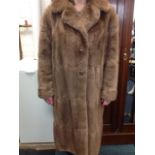 A Jenners of Edinburgh 60s fully lined mink fur coat, with wide collar and large buttons.