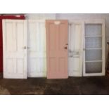 A set of four Victorian interior doors, each with four moulded panels; and a 70s interior glazed