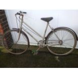A ladies Hercules classic bicycle with two-tone tyres, sprung seat, three gears, etc.