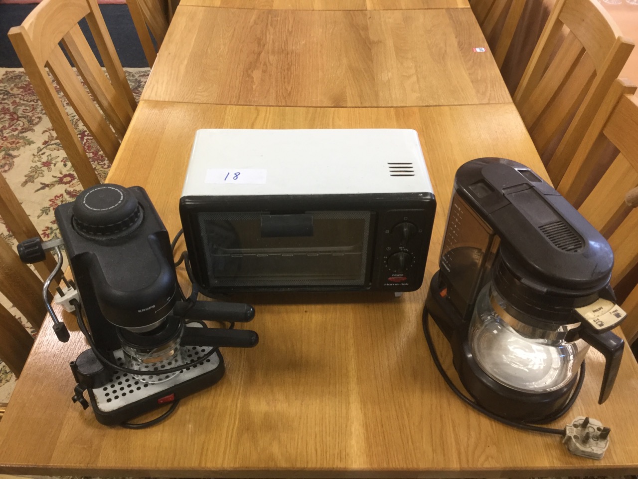 A Philips electric coffee maker, a Hometek miniature oven; and a German Krups coffeemaker. (3)