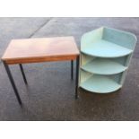 A painted open corner cabinet with three rounded shelves; and a rectangular 70s table supported on