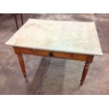 A Victorian kitchen table with rectangular fablon covered top above a single frieze drawer, raised