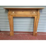 A reproduction hardwood chimneypiece