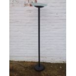 A contemporary uplighter, with frosted glass dish shade on column with weighted base.