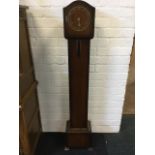 A walnut cased grandmother clock