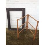 A Victorian carved oak frame with egg & dart decoration; and a pine two-fold drying rack