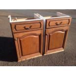 A pair of oak fronted kitchen cabinets