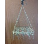 A hanging light, the square tray fitted with nine glass candleholders and hung with crystal drops