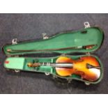 A cased Lark violin with Chinese made bow.