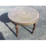 A circular eastern occasional table