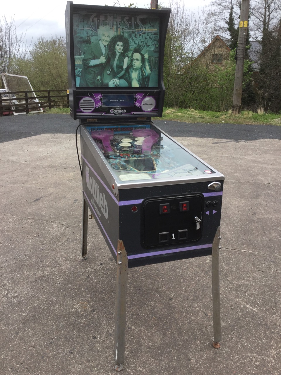 A 80s Cottlieb Premier Genesis pinball machine, with angled gaming board under glass